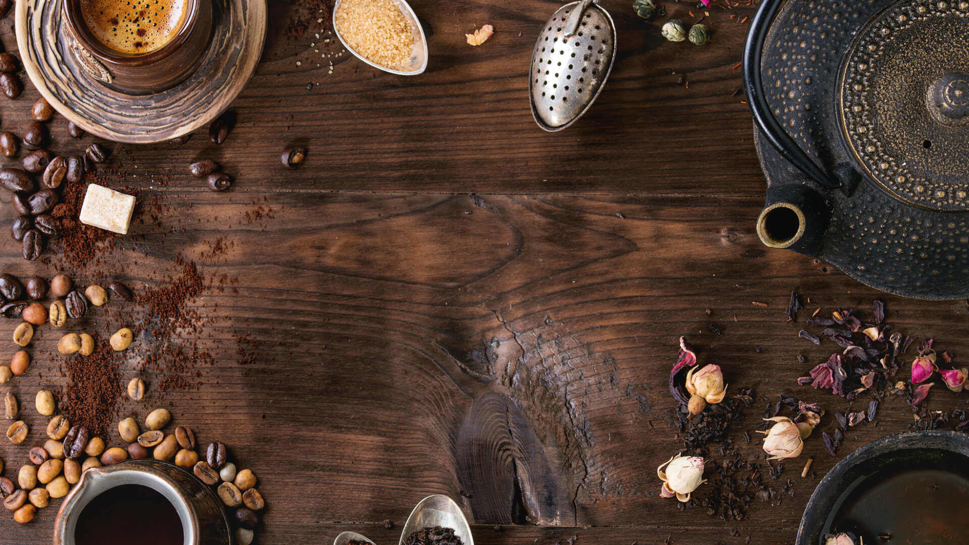 Cup of coffee and cup of tea representing a reflective comparison of personal preference.