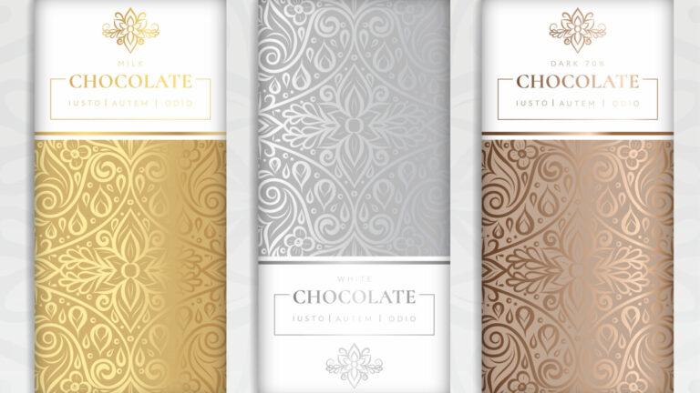 Dark, milk, and white chocolate pieces arranged to compare their differences.