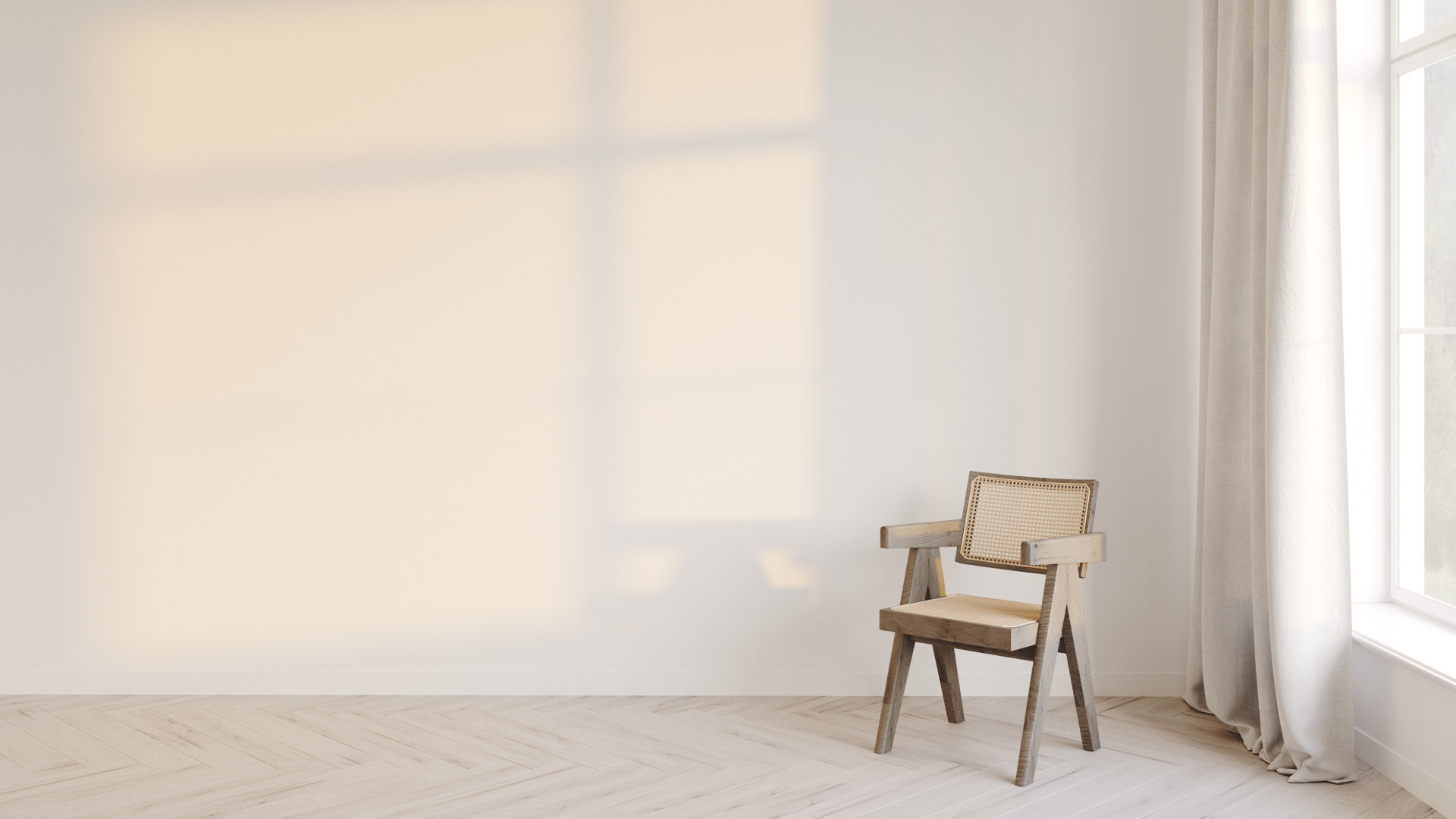 Soft natural light casting a window shadow on a plain wall beside a single chair in a quiet, minimal room