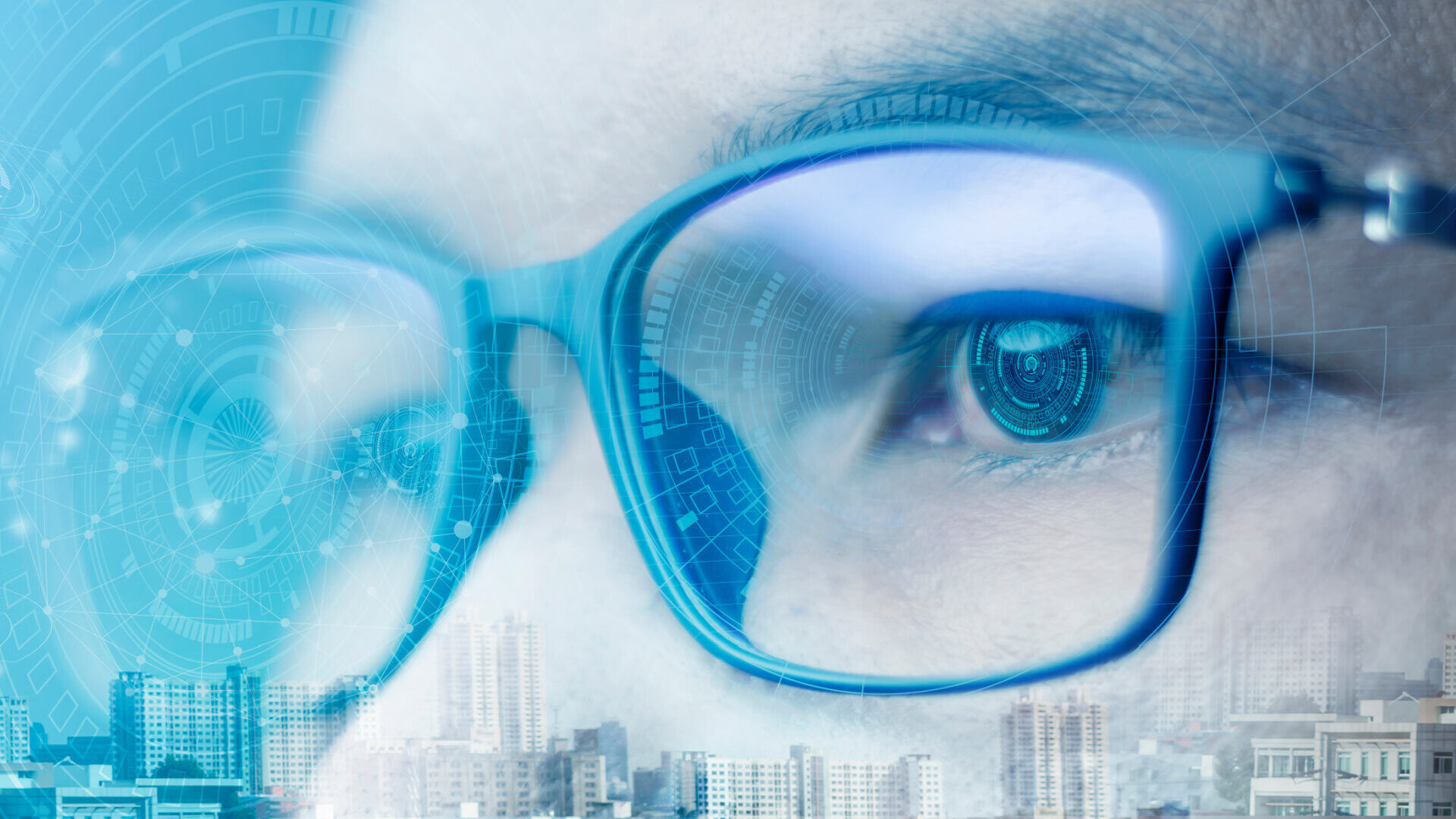 Close-up of a person wearing glasses with a subtle digital interface overlay, representing human focus and the use of modern digital tools in everyday work