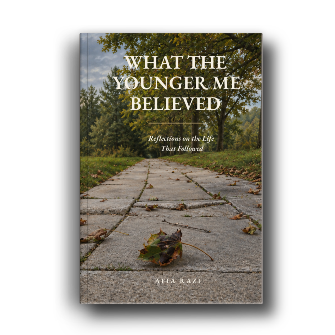 Book cover of What the Younger Me Believed by Afia Razi, featuring a stone pathway beneath autumn trees.